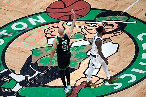 Derrick White celebrates after hitting a 3-pointer